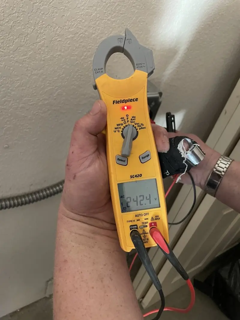 Voltage testing with clamp meter during Ceiling Fan Installation in Orangetown